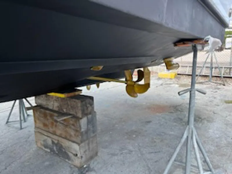 Slide: The Image of 2007 Sea Ray 340 Sundancer boat hull on stands, showing underside details. - 39