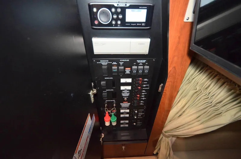 Slide: The Image of Electrical control panel on 2007 Sea Ray 340 Sundancer boat interior. - 9