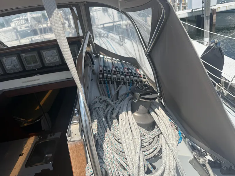 Slide: The Image of Cockpit of 1986 Abbott 36 sailboat with ropes and control panels. - 15