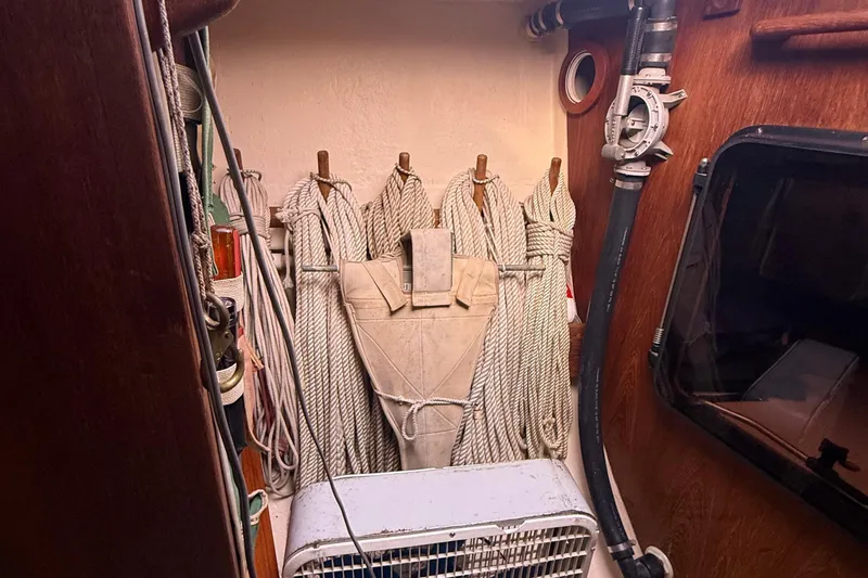 Slide: The Image of Interior of 1986 Abbott 36 sailboat with ropes and nautical equipment. - 20