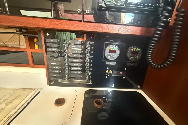 Slide: The Image of Electrical control panel on a 1986 Abbott 36 sailboat, featuring switches and gauges. - 25