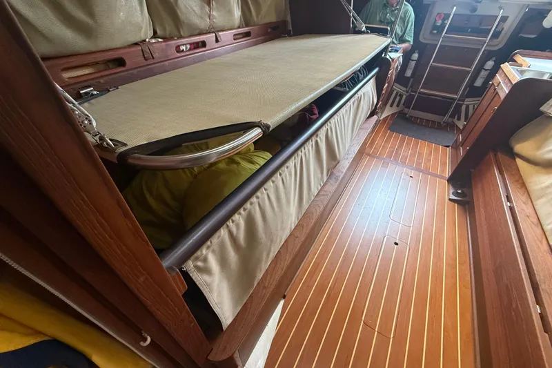 Slide: The Image of Interior of 1986 Abbott 36 sailboat with wooden flooring and foldable bunk. - 28