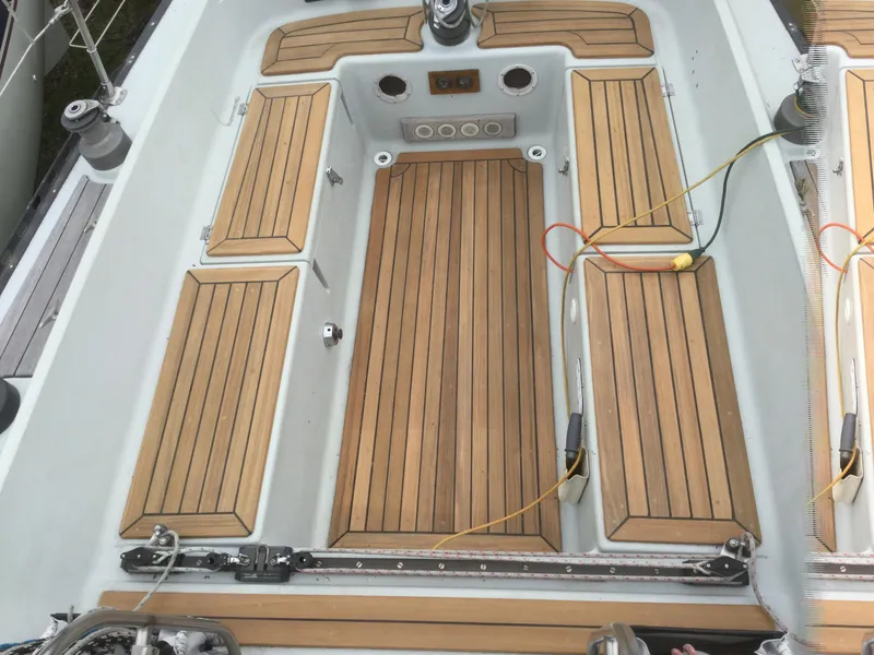 Slide: The Image of Cockpit of 1986 Abbott 36 sailboat with teak flooring and seating. - 3