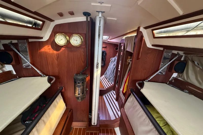 Slide: The Image of Interior of 1986 Abbott 36 sailboat with wooden paneling and nautical instruments. - 32