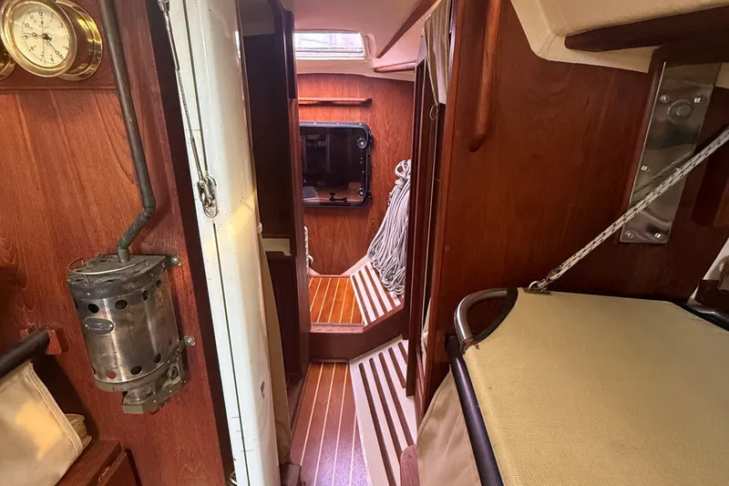 Slide: The Image of Interior of 1986 Abbott 36 sailboat with wooden paneling and nautical equipment. - 33
