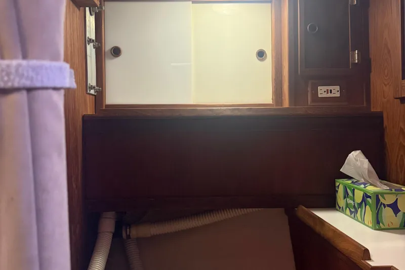 Slide: The Image of Wooden interior of 1986 Abbott 36 boat with storage and tissue box. - 35