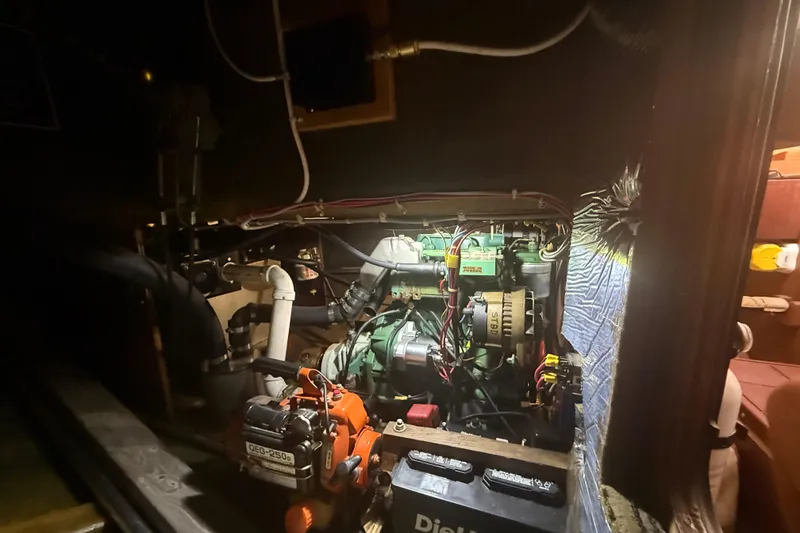 Slide: The Image of Engine compartment of a 1986 Abbott 36, featuring various mechanical components and wiring. - 40