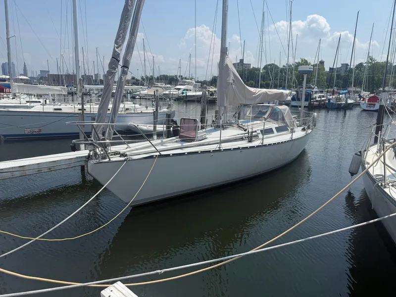 Slide: The Image of 1986 Abbott 36 sailboat docked in a marina under a clear sky. - 7