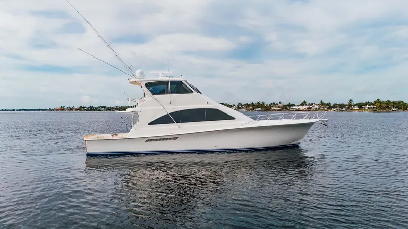 Slide: The Image of 2003 Ocean Yachts 62 Enclosed Bridge Super Sport on calm water. - 1