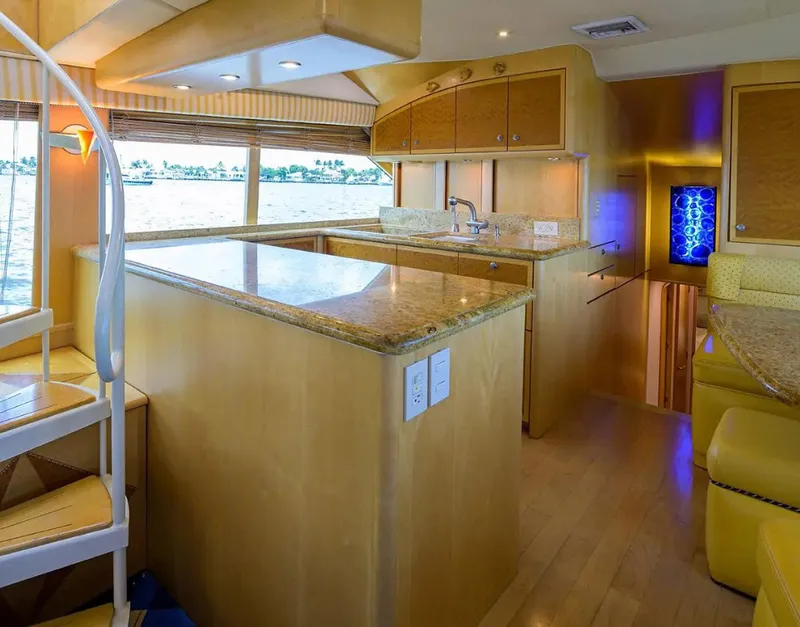 Slide: The Image of Luxurious interior of 2003 Ocean Yachts 62 Enclosed Bridge Super Sport with modern kitchen design. - 13