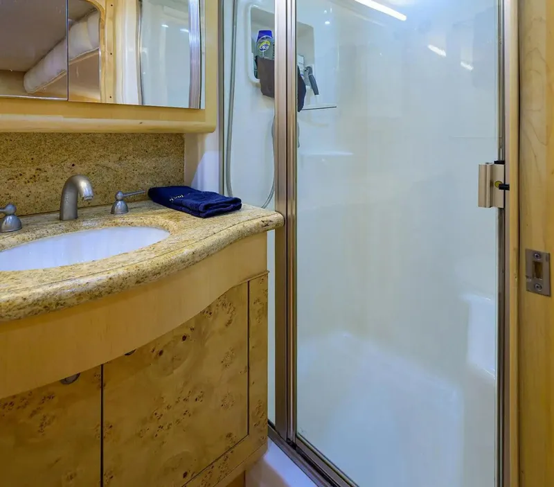 Slide: The Image of Luxurious bathroom in 2003 Ocean Yachts 62 Enclosed Bridge Super Sport. - 24
