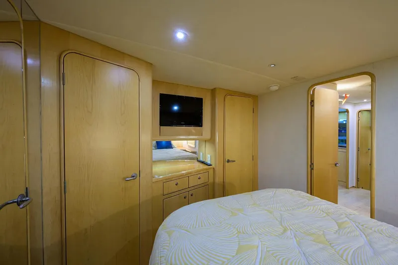 Slide: The Image of Luxurious bedroom interior of 2003 Ocean Yachts 62 Enclosed Bridge Super Sport. - 29