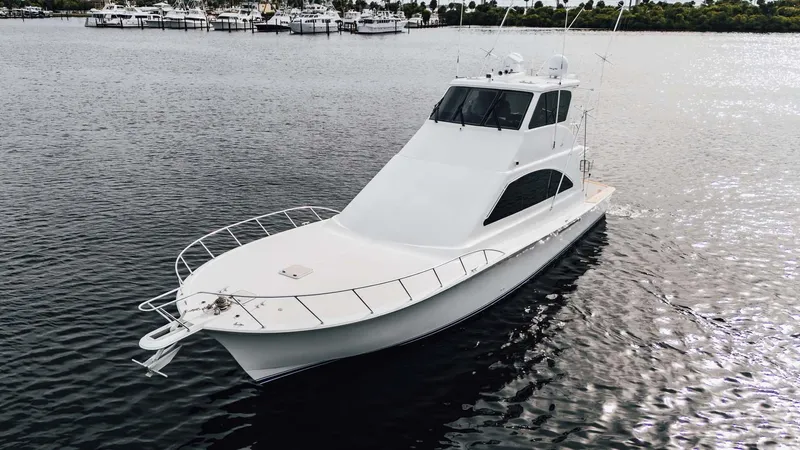 Slide: The Image of 2003 Ocean Yachts 62 Enclosed Bridge Super Sport on calm water. - 4