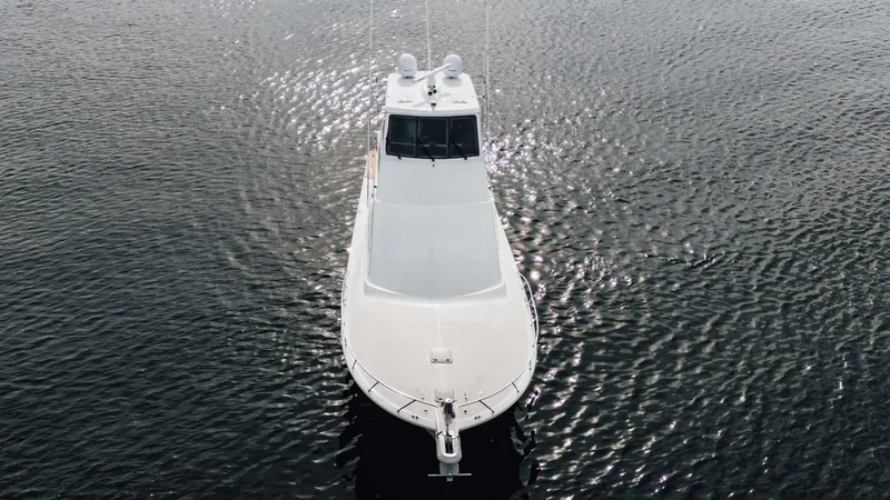 Slide: The Image of 2003 Ocean Yachts 62 Enclosed Bridge Super Sport on calm water. - 5