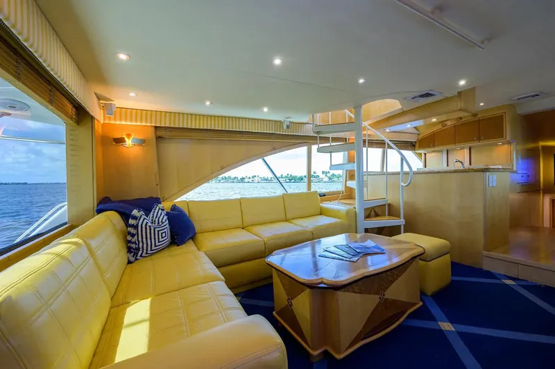 Slide: The Image of Luxurious interior of 2003 Ocean Yachts 62 Enclosed Bridge Super Sport with yellow seating. - 8