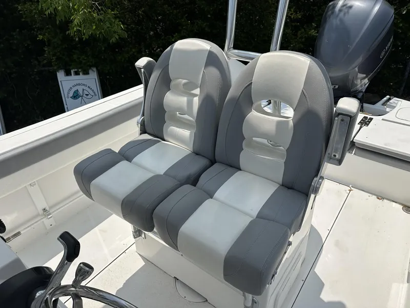 Slide: The Image of Dual gray and white boat seats on a 2020 Release 240 R model. - 12