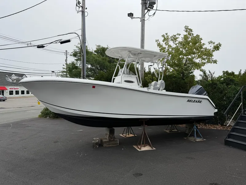 Slide: The Image of 2020 Release 240 R boat on display, elevated on stands, in an outdoor setting. - 3