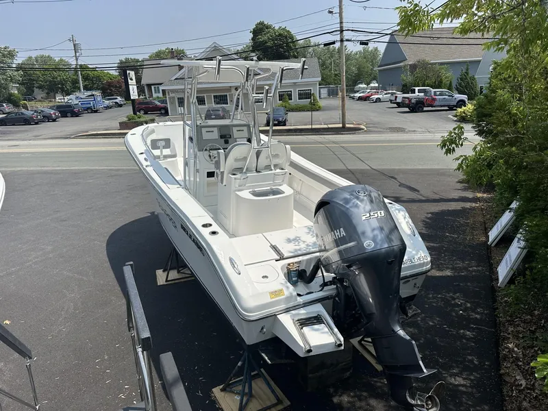 Slide: The Image of 2020 Release 240 R boat with Yamaha 250 engine, parked outdoors. - 4