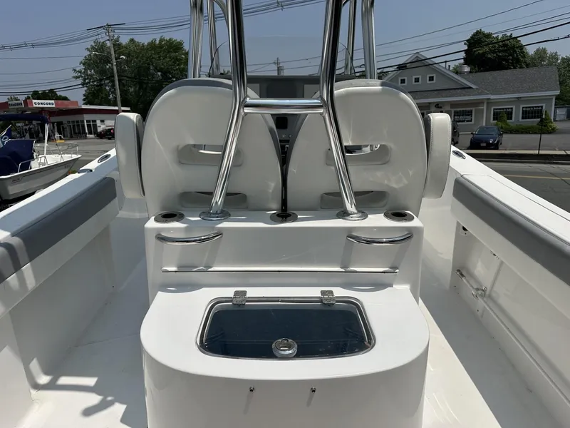 Slide: The Image of 2020 Release 240 R boat interior with seating and storage compartments. - 9