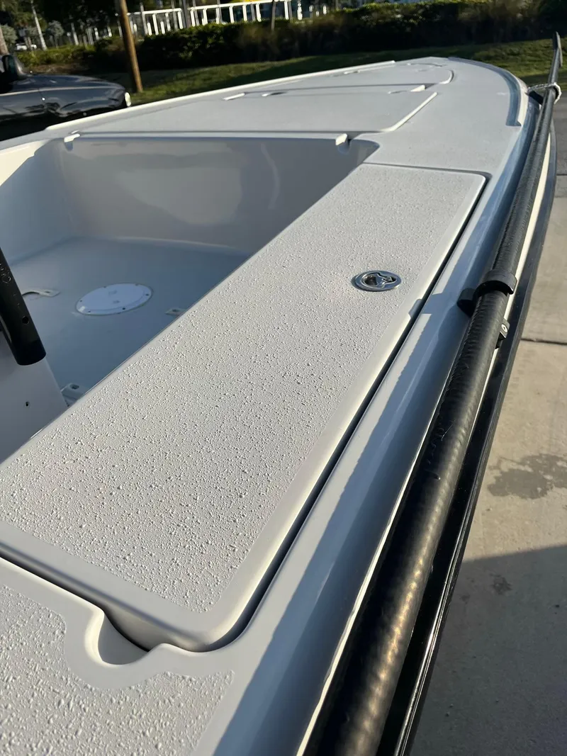 Slide: The Image of 2002 Back Country 201 Pro Guide boat deck, featuring textured surface and storage compartments. - 12