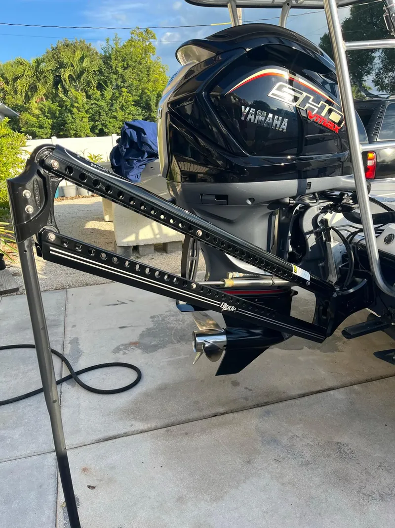 Slide: The Image of 2002 Back Country 201 Pro Guide boat with Yamaha SHO engine, parked on concrete. - 3