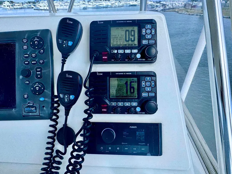 Slide: The Image of Control panel of 2002 Cabo 47 Flybridge Sportfisher with communication devices. - 40