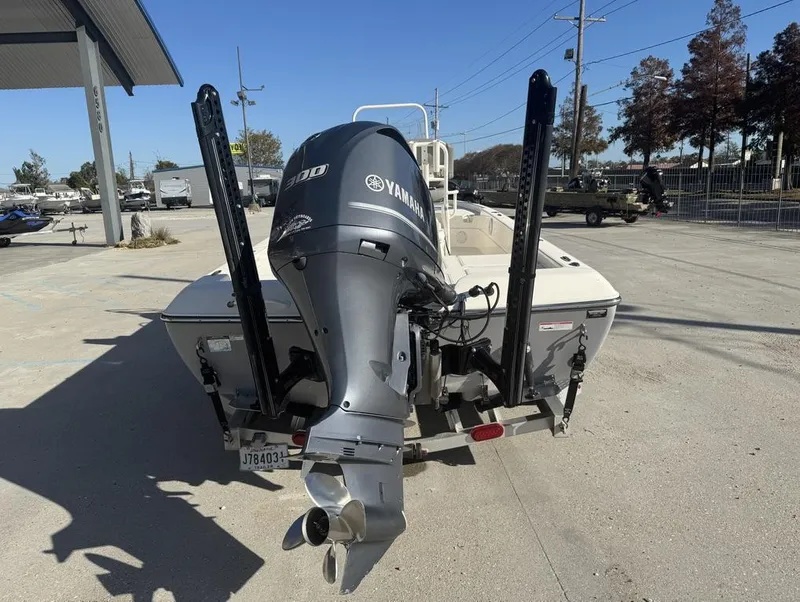 Slide: The Image of 2019 Skeeter SX 240 boat with Yamaha 300 engine, parked outdoors. - 12