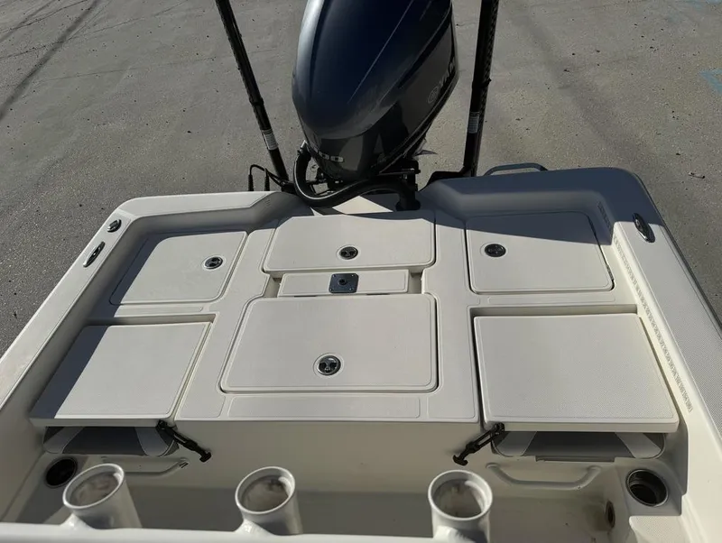 Slide: The Image of 2019 Skeeter SX 240 boat deck with storage compartments and motor. - 13