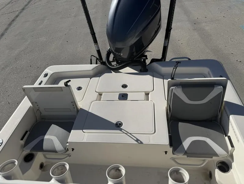 Slide: The Image of 2019 Skeeter SX 240 boat interior with seating and motor, viewed from above. - 14