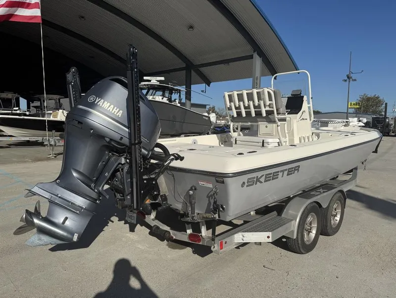 Slide: The Image of 2019 Skeeter SX 240 boat with Yamaha engine on trailer, parked outdoors. - 5