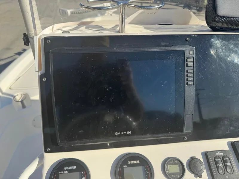 Slide: The Image of Dashboard of a 2019 Skeeter SX 240 boat with Garmin display and Yamaha gauges. - 7