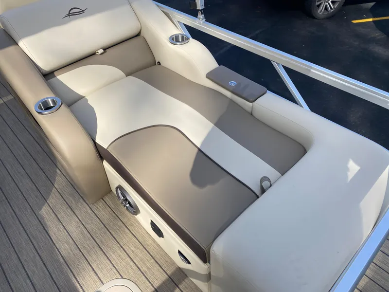Slide: The Image of 2025 SunCatcher Select 322SS boat seat with cup holders and beige upholstery. - 11