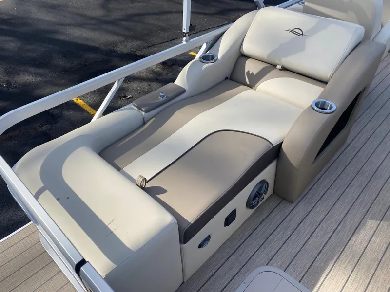 Slide: The Image of Luxurious seating on 2025 SunCatcher Select 322SS pontoon boat with cup holders. - 12
