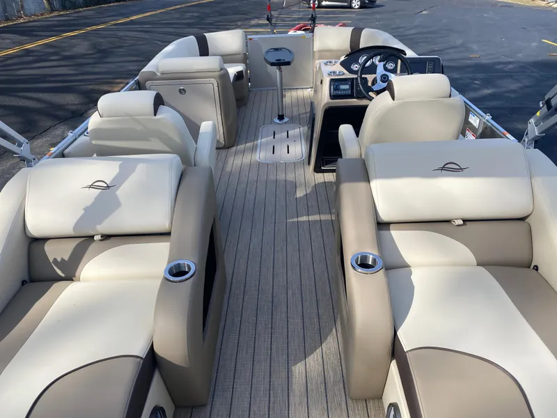 Slide: The Image of 2025 SunCatcher Select 322SS pontoon boat interior with luxurious seating and modern design. - 13