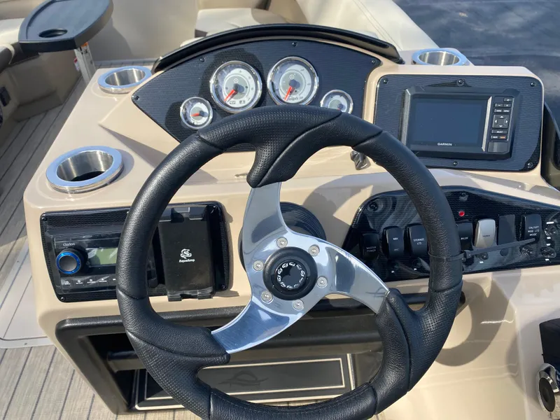 Slide: The Image of Steering console of 2025 SunCatcher Select 322SS boat with gauges and controls. - 18