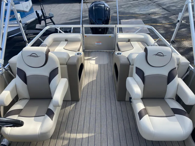 Slide: The Image of 2025 SunCatcher Select 322SS pontoon boat interior with plush seating and modern design. - 21