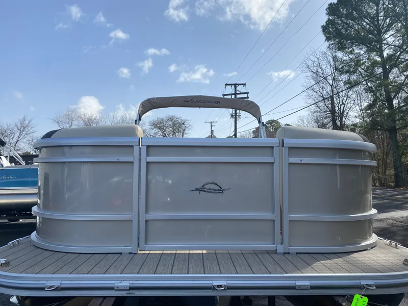 Slide: The Image of 2025 SunCatcher Select 322SS pontoon boat, rear view, on a sunny day. - 7