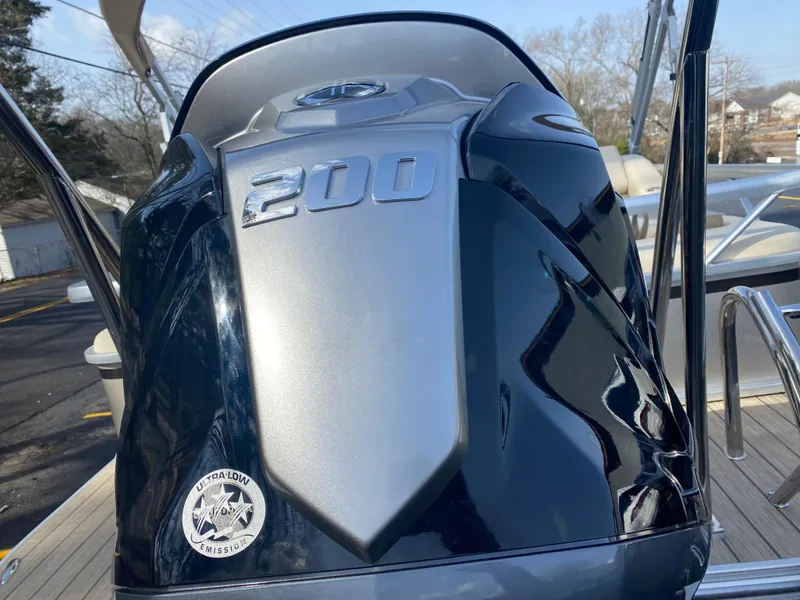 Slide: The Image of Outboard motor on 2025 SunCatcher Select 322SS boat, featuring a 200 horsepower engine. - 9