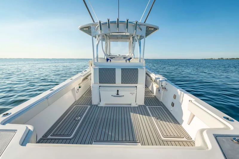 Slide: The Image of 2021 Front Runner 36 Center Console boat on calm ocean waters. - 11