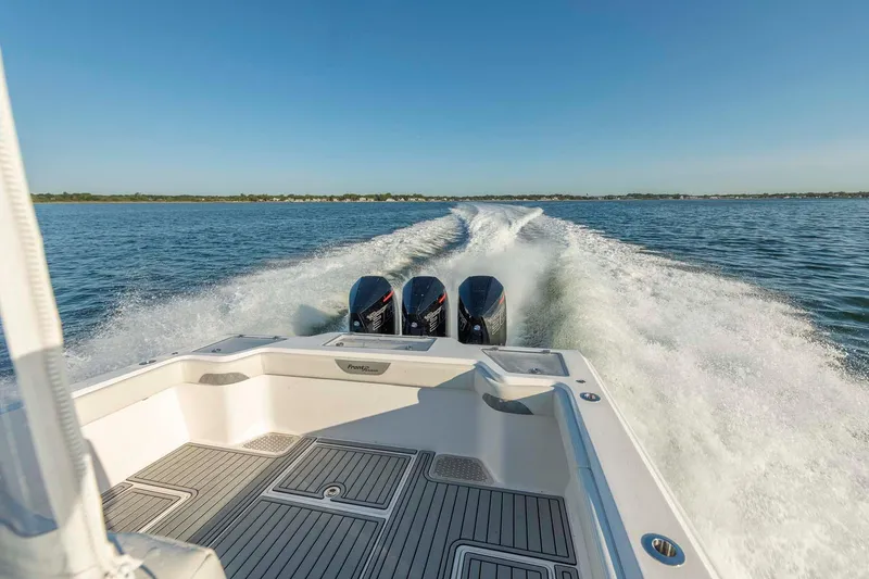 Slide: The Image of 2021 Front Runner 36 Center Console boat cruising on open water. - 12