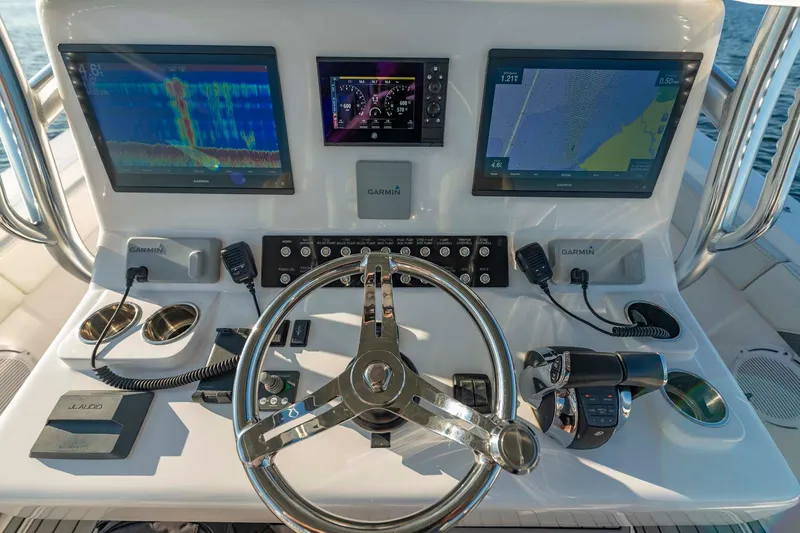 Slide: The Image of 2021 Front Runner 36 Center Console dashboard with advanced navigation displays and controls. - 21