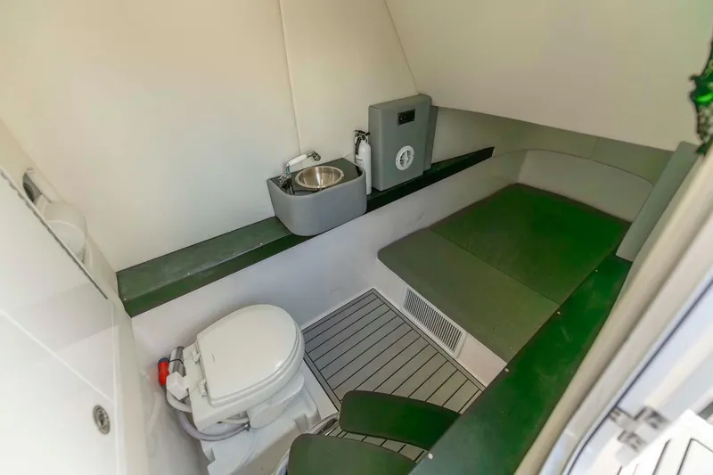 Slide: The Image of 2021 Front Runner 36 Center Console interior with toilet and sink. - 29