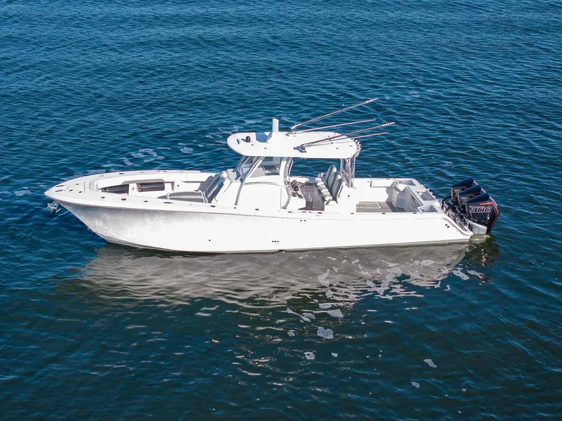 Slide: The Image of 2021 Front Runner 36 Center Console boat on calm blue water. - 4