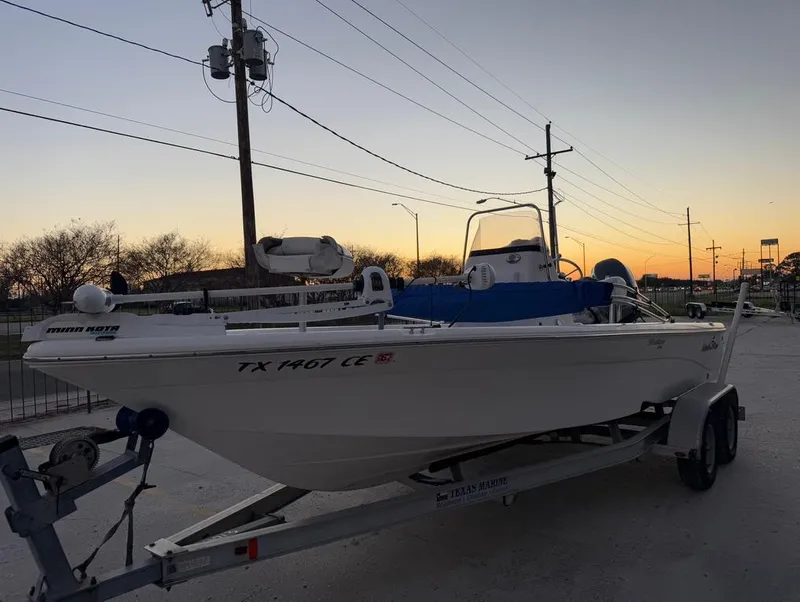 Slide: The Image of 2014 NauticStar 215 XTS Shallow Bay boat on trailer at sunset. - 3