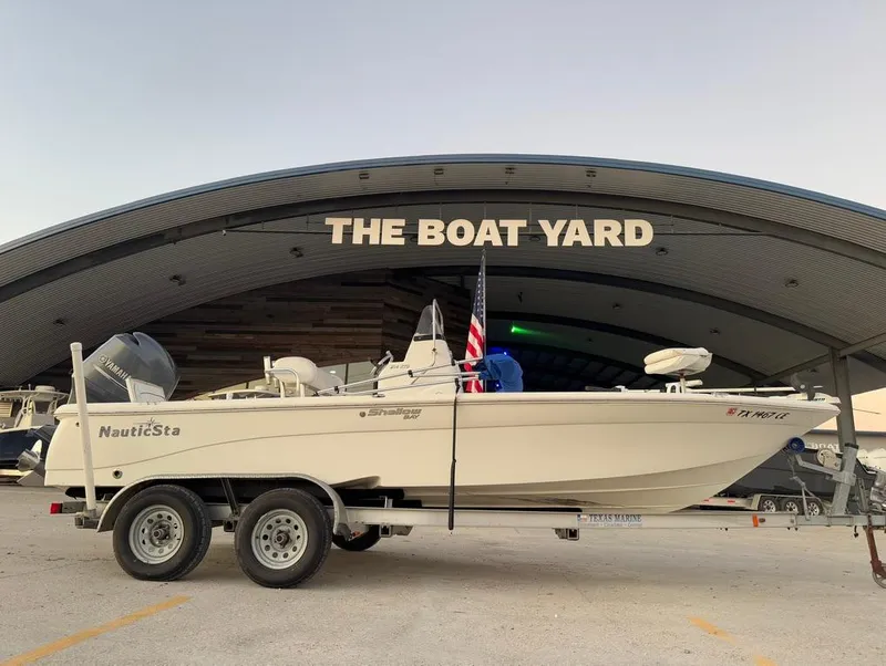 Slide: The Image of 2014 NauticStar 215 XTS Shallow Bay boat on trailer at The Boat Yard. - 6
