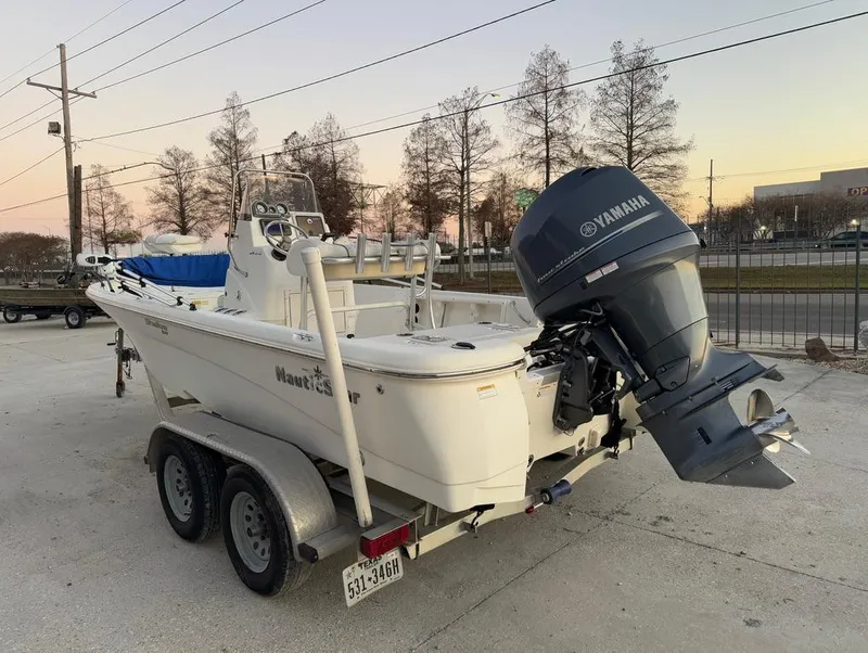 Slide: The Image of 2014 NauticStar 215 XTS Shallow Bay boat with Yamaha outboard on trailer. - 9