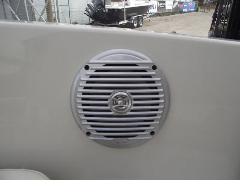 Slide: The Image of 2016 Stingray 182 SC boat speaker detail, white grille, outdoor setting. - 22