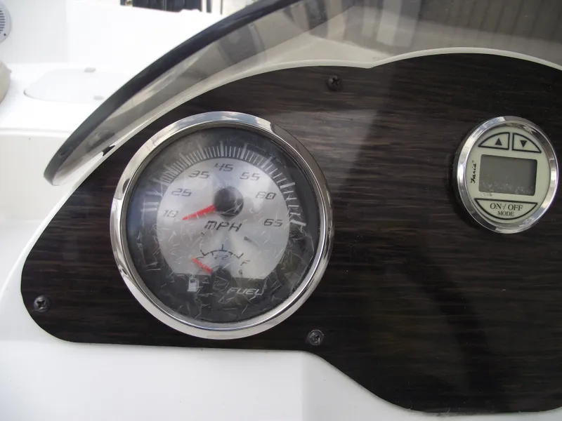 Slide: The Image of Dashboard of 2016 Stingray 182 SC boat with speedometer and digital display. - 25