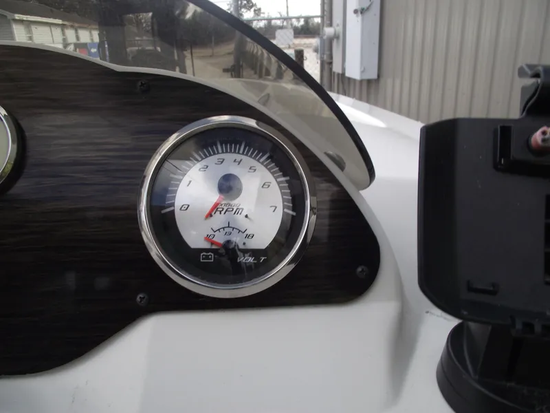 Slide: The Image of Tachometer of 2016 Stingray 182 SC boat dashboard, showing RPM gauge. - 26