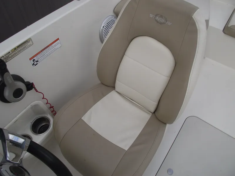 Slide: The Image of 2016 Stingray 182 SC boat seat with beige and white upholstery. - 28